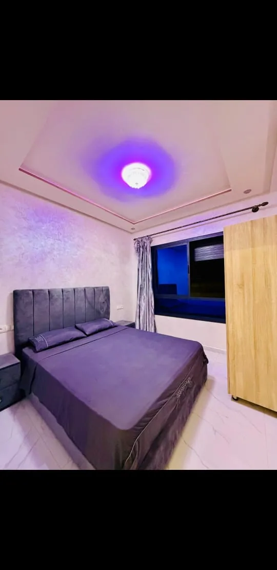Double bedroom with grey bed linen