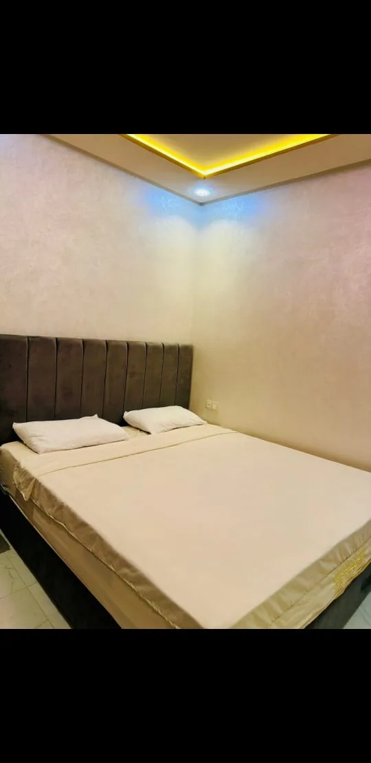 Double bedroom with cream bed linen