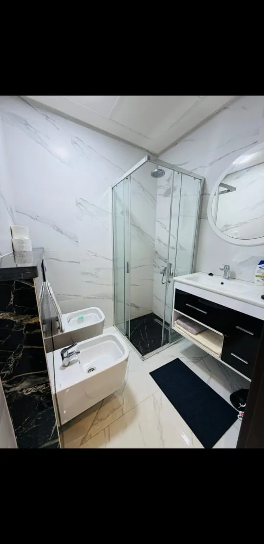 Bathroom with glass shower and vanity